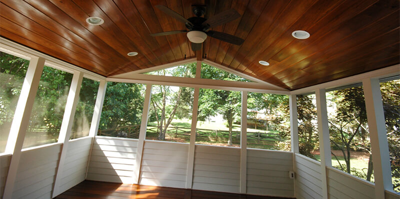 Screened in porch with premium wood paneling and floor