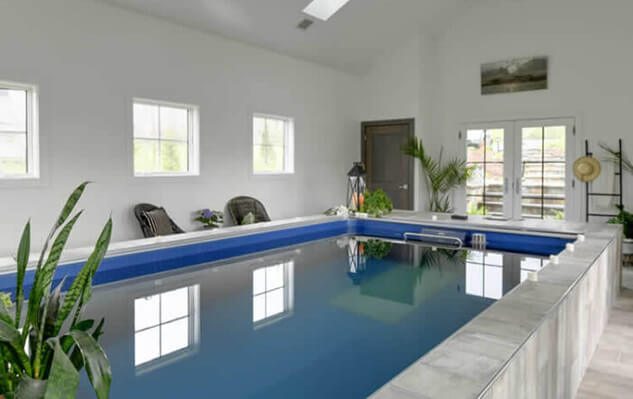 Gazing on the indoor pool from end to end great image with windows and natural lighting